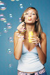 Woman blowing bubbles