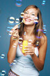 Woman blowing bubbles