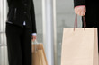 Waist down shot of two business women carrying paper bags 