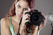 Woman photographer holding a camera