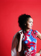 Woman in floral dress posing for the camera