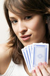 Woman holding playing cards