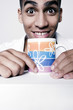 Man with big wide eyes holding a cup