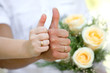 Bride and groom hands with rings show at the wedding