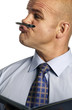 Photo: Man holding a pen in between his nose and lips Man holding a pen in between his nose and lips