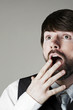 Businessman looking up in disbelief