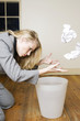 Businesswoman ransacking the dustbin