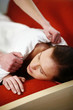 Man covering his wife with a blanket