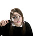 Girl using magnifying glass