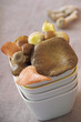 Various mushrooms in a stacked bowl