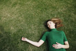 Woman lying on the field