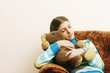 Girl hugging her teddy bear while sleeping on the couch