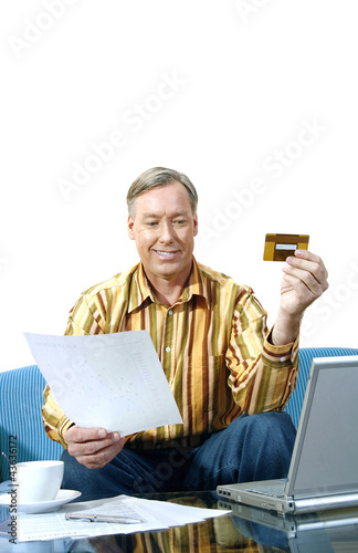 Photo: Man using laptop Man using laptop