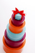 A stack of gift boxes with a ribbon on the top