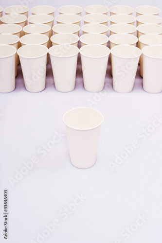 Photo: A group of paper cups with an isolated paper cup A group of paper cups with an isolated paper cup
