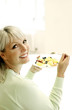 Woman holding a bowl of fruits