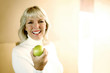 Woman holding a green apple