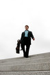 Businessman walking down the stairs
