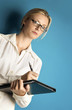 Woman with glasses writing