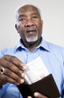 Senior man taking out money from his wallet
