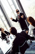 Blindfolded businessman talking in the conference room