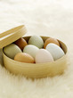 Coloured eggs in bowls
