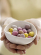 Mini eggs in bowl with model