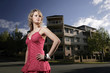 A teenage girl posing in front of the apartment