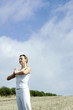 Woman practicing yoga on the field