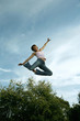 Teenage girl jumping with joy