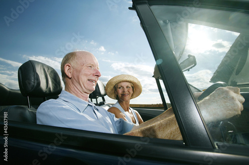 Photo: Senior couple travelling together in the car Senior couple travelling together in the car