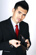 Businessman showing his empty wallet