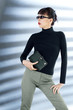 Businesswoman with sunglasses holding an organiser