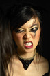 Photo: Woman with smudged mascara clenching her teeth Woman with smudged mascara clenching her teeth