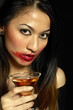 Woman with smudged lipstick holding a glass of champagne