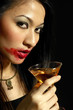 Woman with smudged lipstick holding a glass of champagne