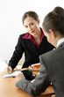 Businesswomen eating while having discussion