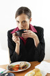 Businesswoman drinking from a cup