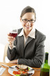 Businesswoman holding a glass of wine