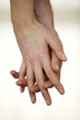 Intimate couple hand in hand