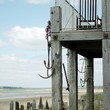 Photo: Old rusted anchors hanging on lifeguard tower Old rusted anchors hanging on lifeguard tower
