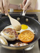 Frying bacon, eggs and sausages