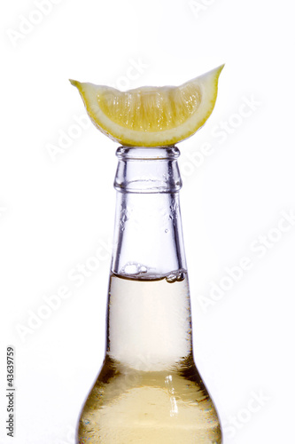 Photo: Lemon on a glass bottle Lemon on a glass bottle
