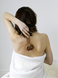 Woman massaging her back