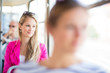 Pretty, young woman on a streetcar/tramway