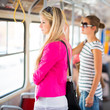Pretty, young woman on a streetcar/tramway