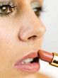 Applying lipstick