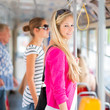 Foto: Pretty, young woman on a streetcar/tramway Pretty, young woman on a streetcar/tramway