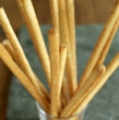 Italian sesame breadsticks in a glass