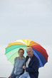 A senior couple resting after a stroll at the beach